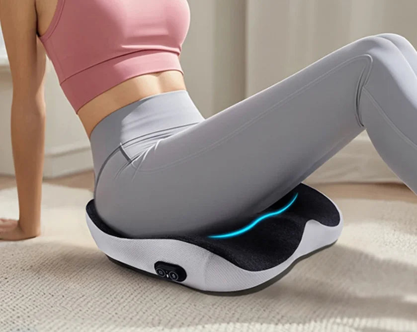 Massage cushion for office use, designed to relieve pressure on the coccyx from prolonged sitting, with vibration
